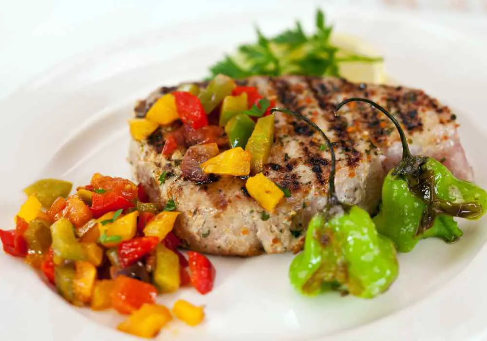 tuna steak served with herbs and spices