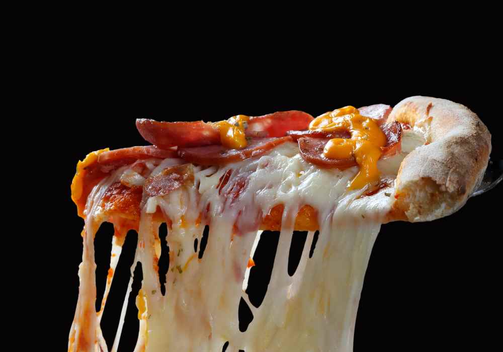 pizza slice with melted cheese